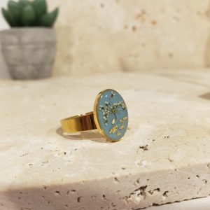 bague doré bleue, fleur