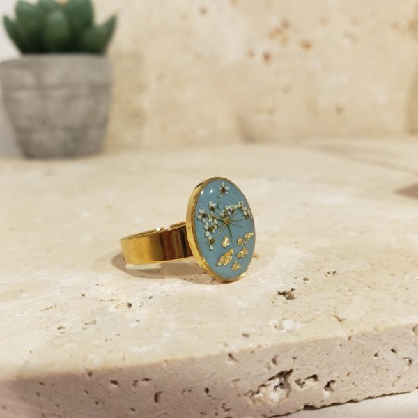 bague doré bleue, fleur